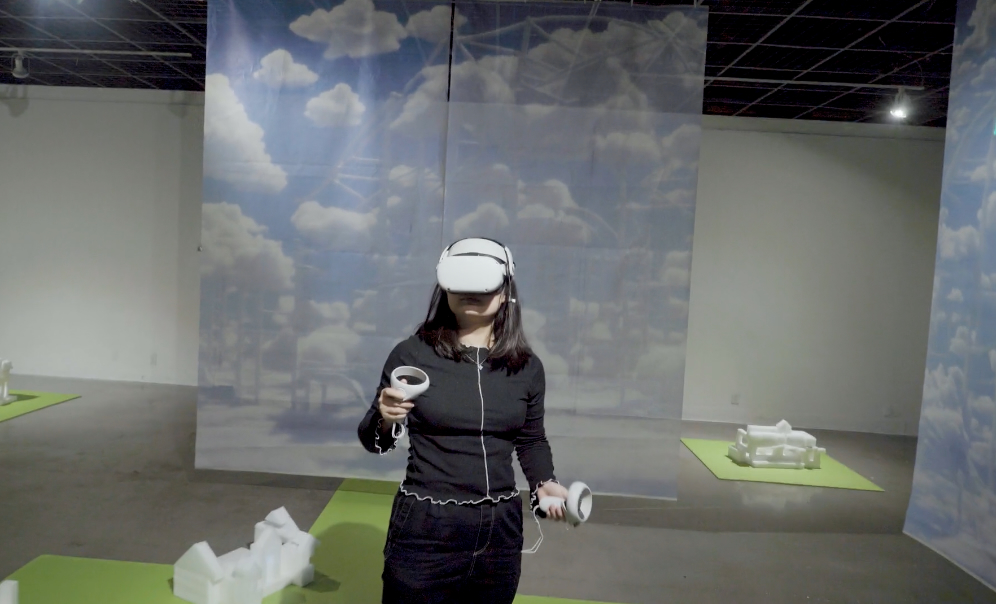 woman wearing VR headset with cloud background behind her