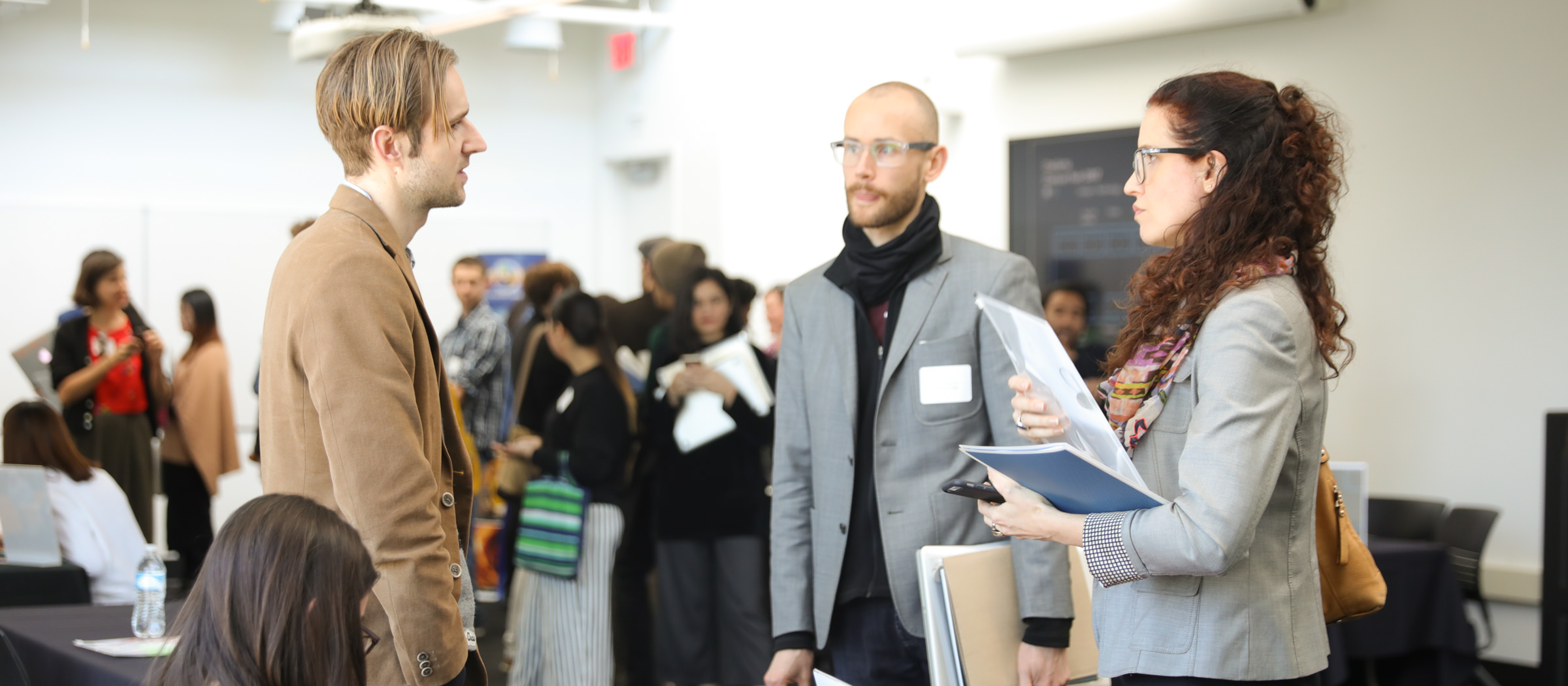 Image of a group of people talking during an event