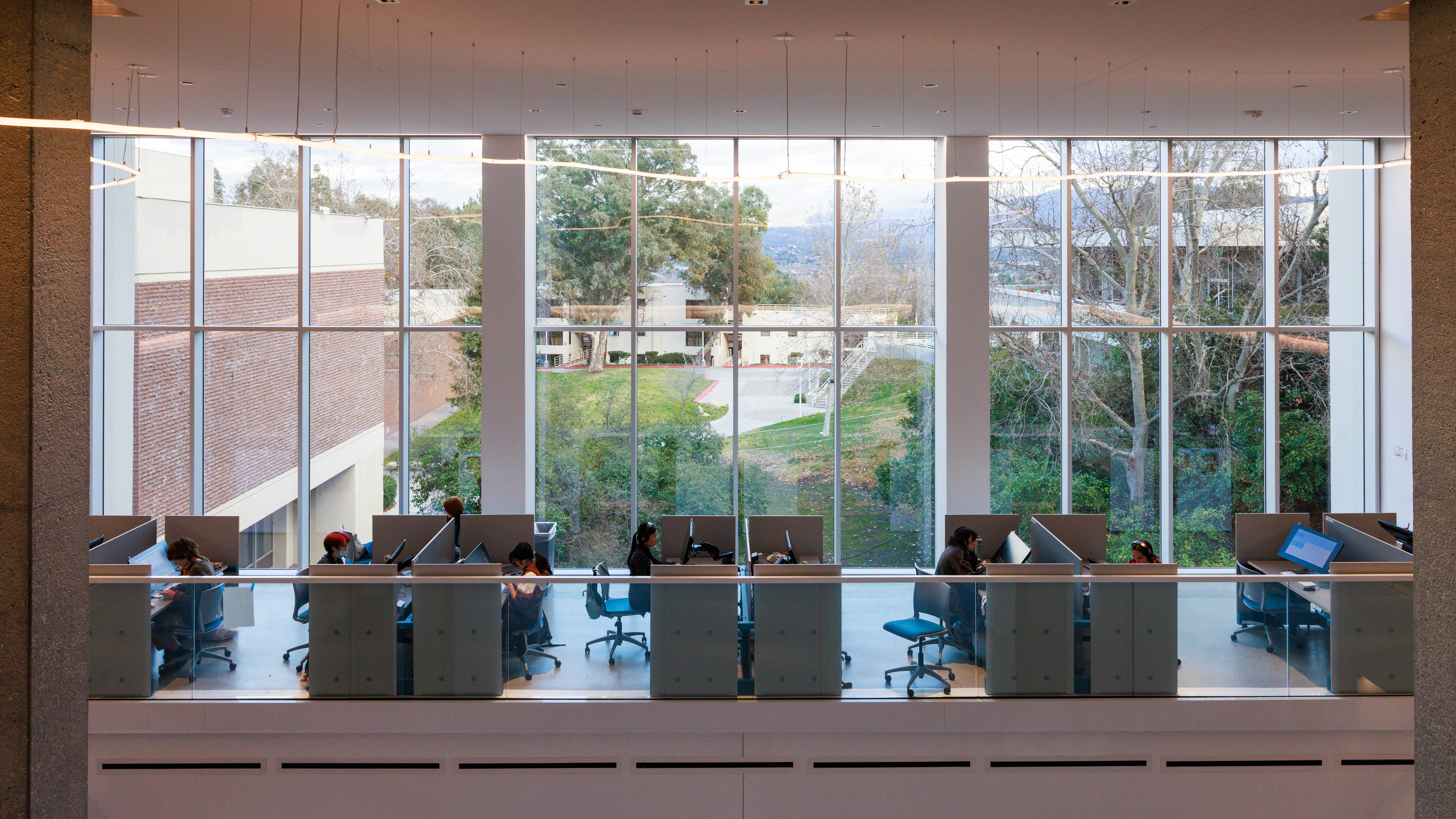 students desks in the anomation wing at CalArts, in front of a large window