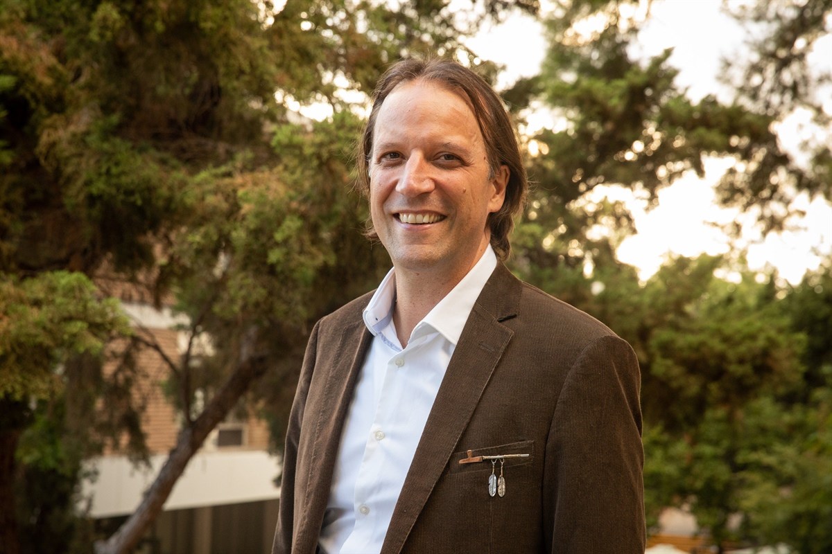 Photo of Chad Hamill with trees in the background