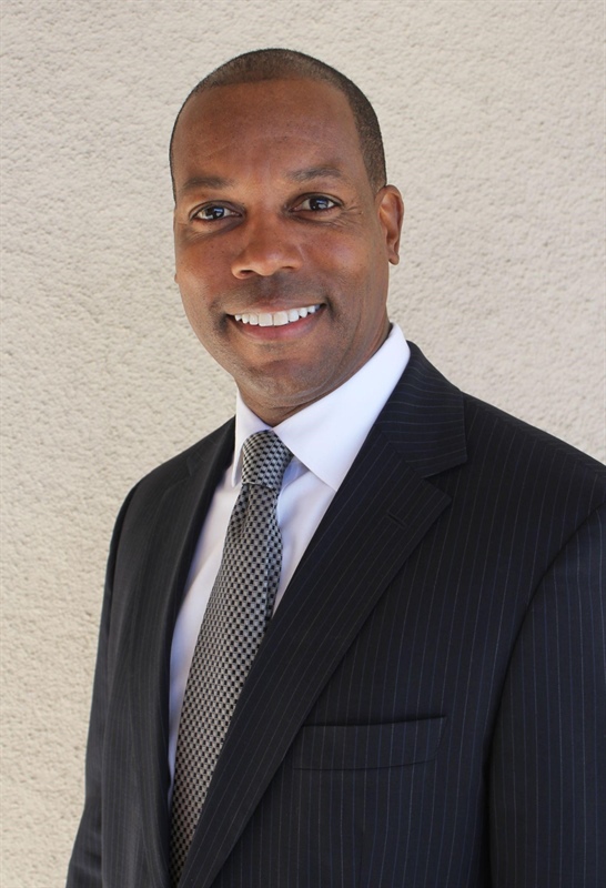 Headshot of Troy Allen wearing a suit