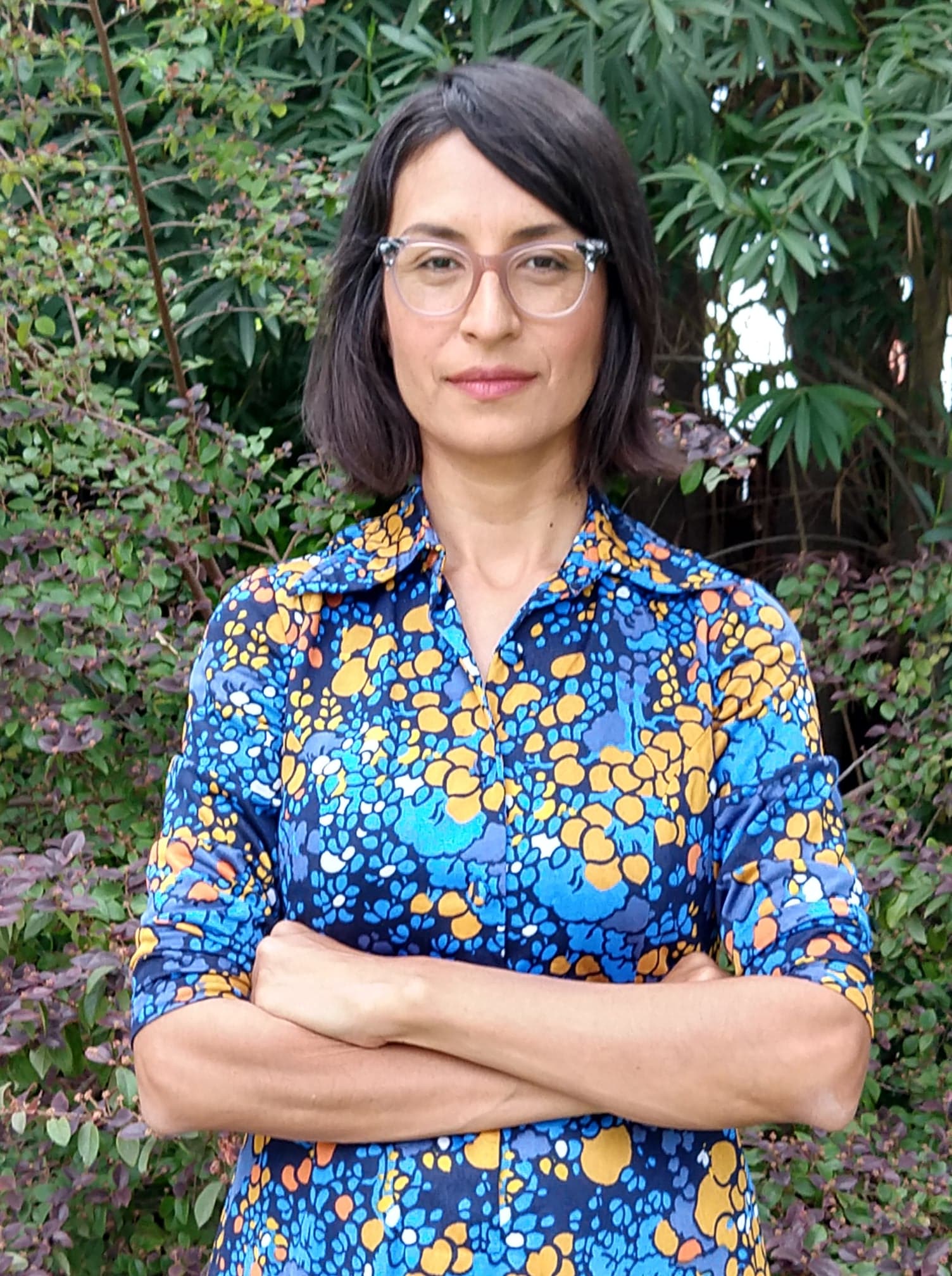 CalArts professor Carribean Fragoza crosses her arms and looks straight at the camera.