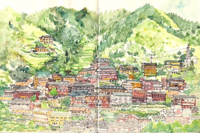 Watercolor painting of a mountainous village landscape with colorful buildings and green hills in the background.