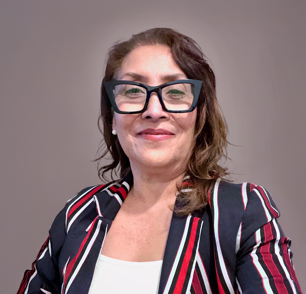 Maria I. Ramos wears dark eyeglasses and a a navy, maroon and white striped blazer over a white shirt. 