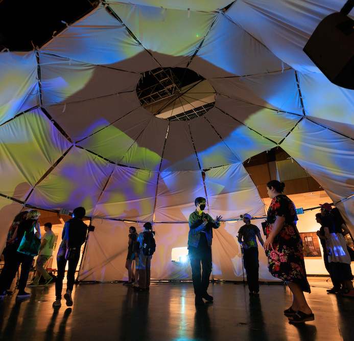 Visitors enjoying an exhibit during CalArts Expo 2024. 