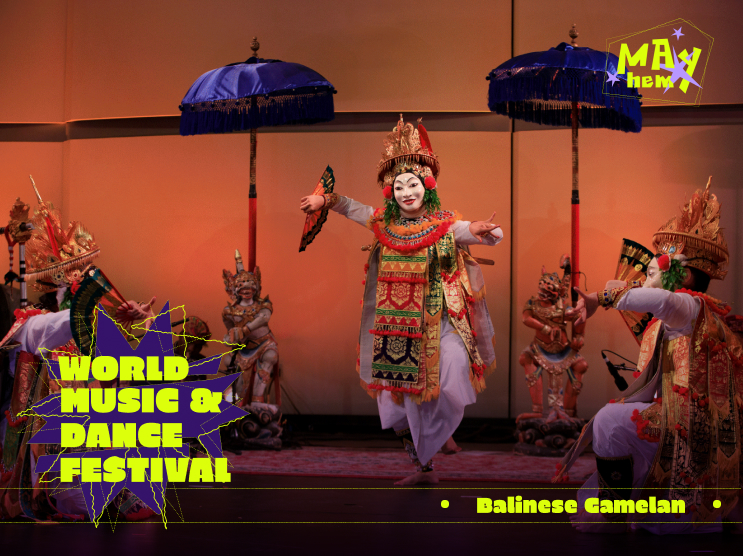Balinese dancer performing in traditional costume at a music and dance festival.