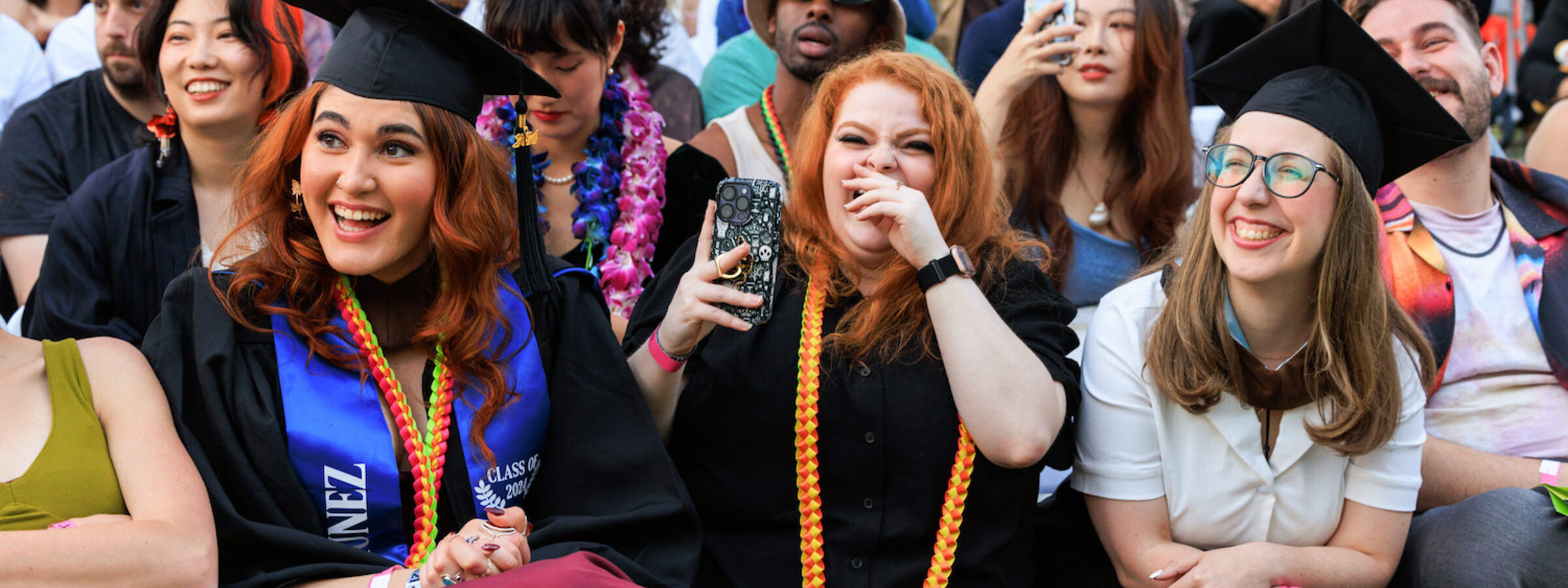 Students laughing at CalArts graduation