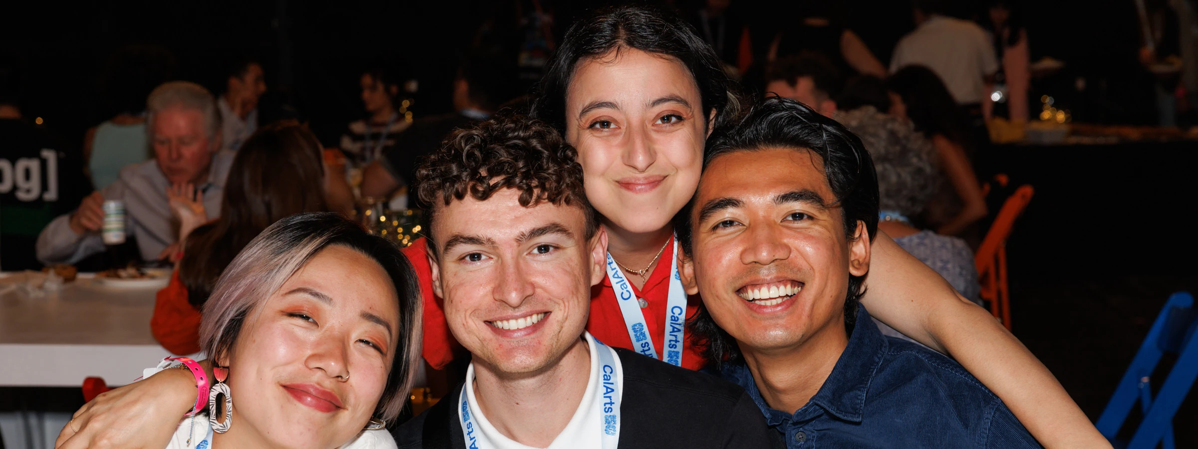 Image of people together smiling at an event