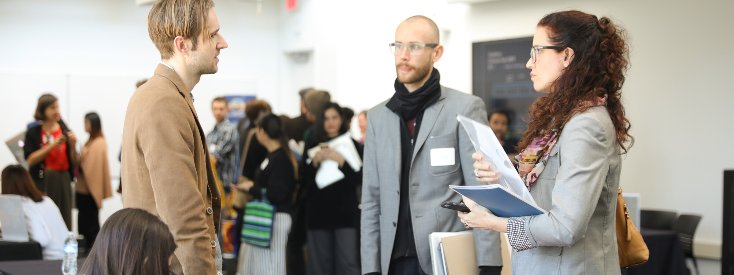 Image of a group of people talking during an event