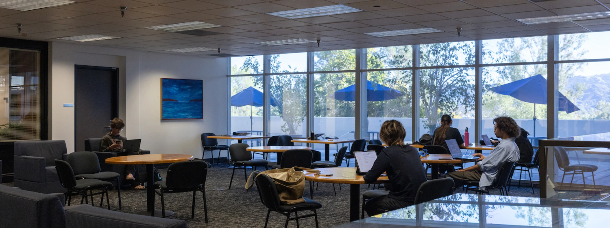 Students reading in the lounge area of CalArts library