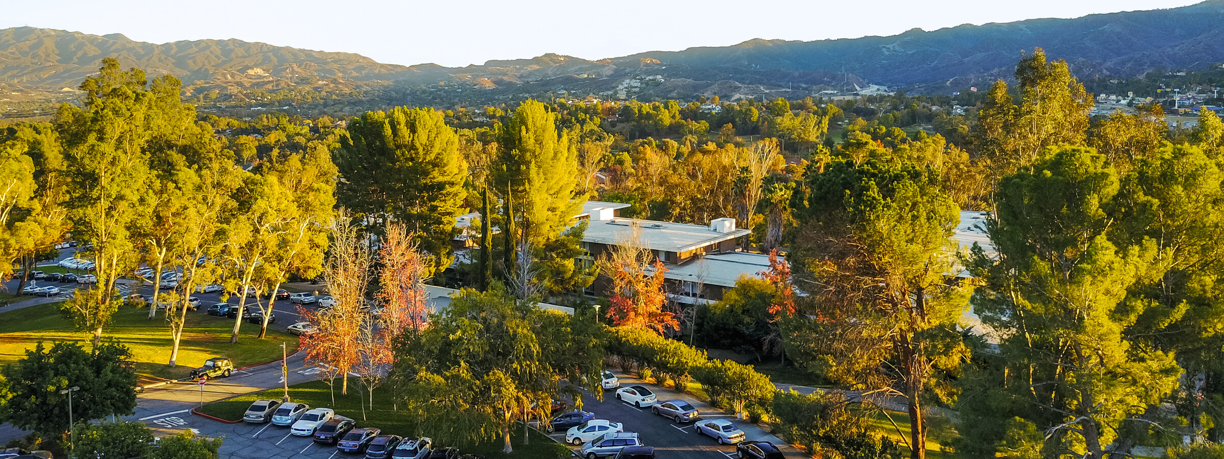 An aerial view of the Chouinard dorm on the CalArts campus in evening light