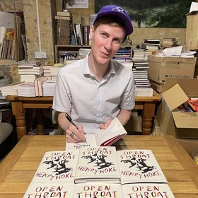 Henry Hoke signing copies of his book Open Throat