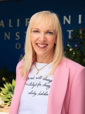 portrait of Katie Nicely in front of the Blue Wall at CalArts