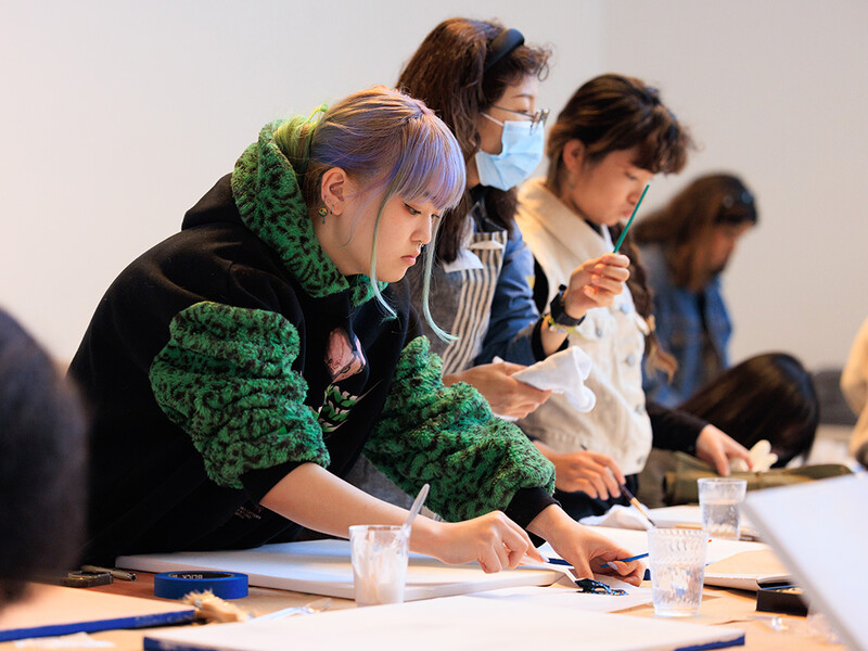 Students painting in studio class