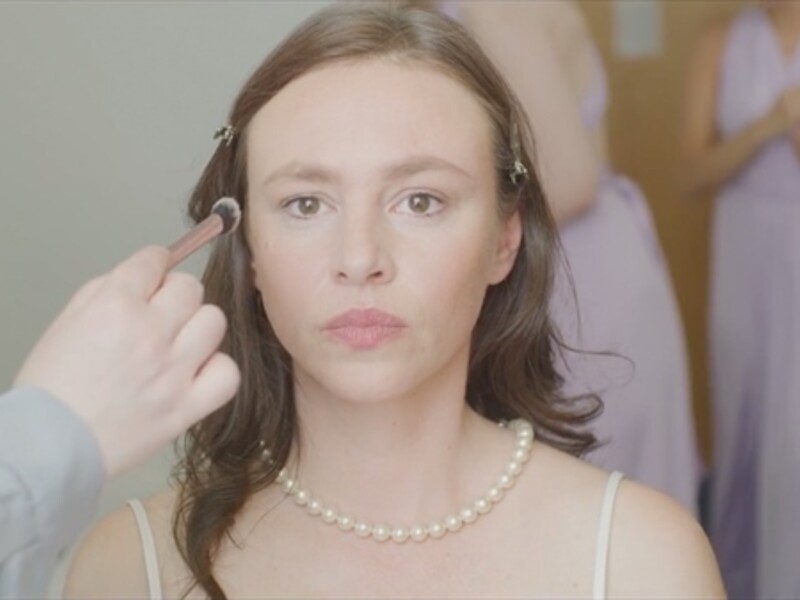 woman getting her makeup done