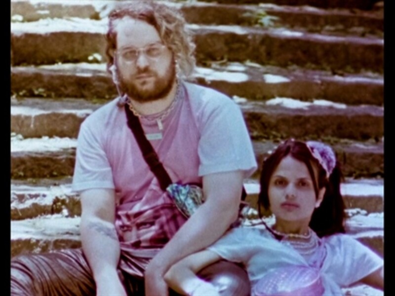 two people sitting on a staircase