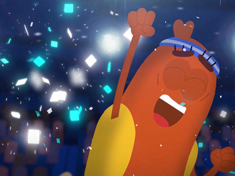 Animated hot dog character with raised arm and blue goggles, surrounded by white and blue confetti.