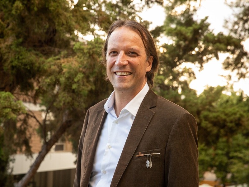 Photo of Chad Hamill with trees in the background