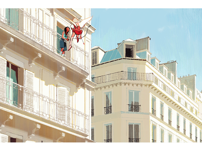 A woman on a balcony interacts with a small red-winged creature in a cityscape with European architecture.