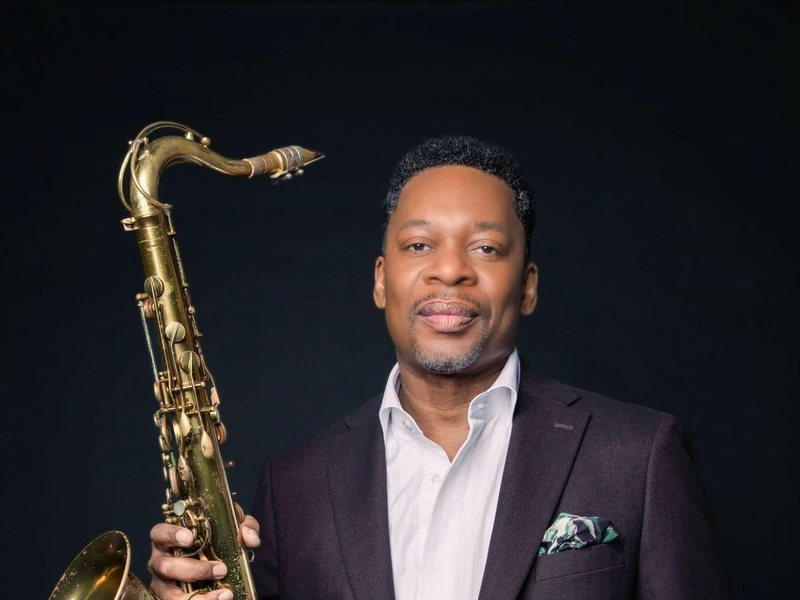 Ravi Coltrane holding a saxophone