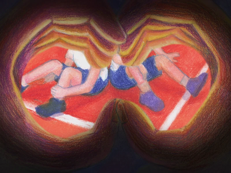 A view through hands formed like binoculars, showing two athletes on a red track.