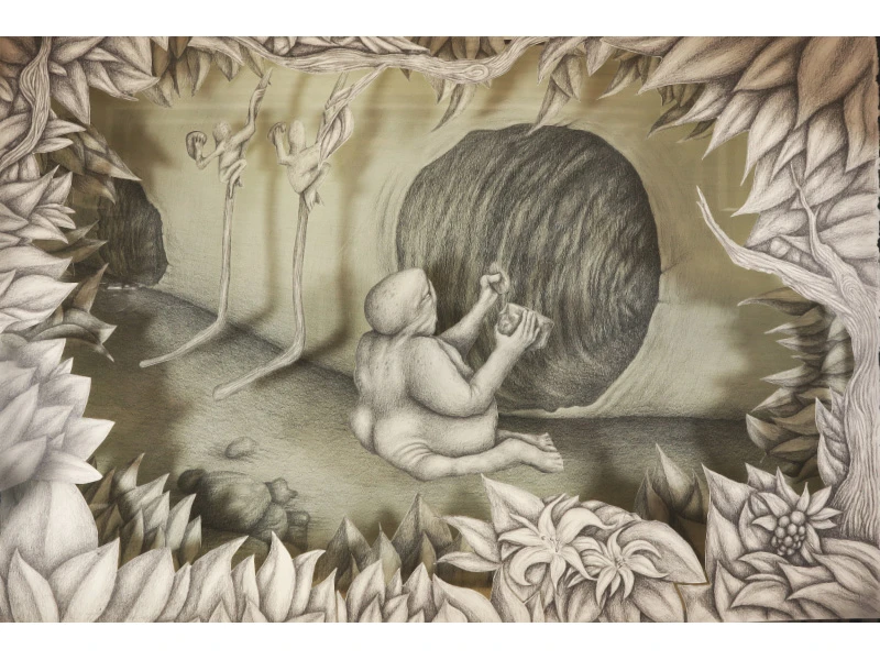 A humanoid figure sits in a cave-like setting, interacting with a large spherical object, flanked by two elongated abstract figures, with a frame of detailed leaves and flowers.