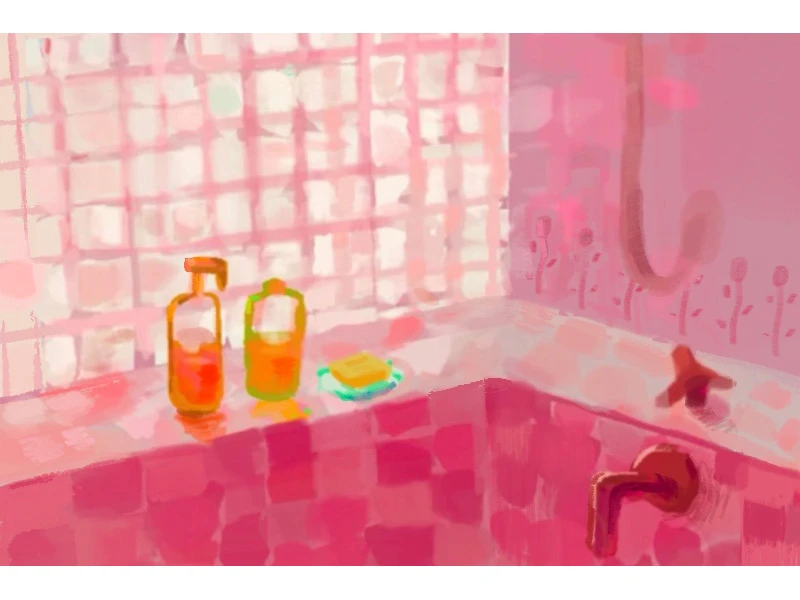 A pink-tiled bathroom with two bottles and soap on the tub ledge.
