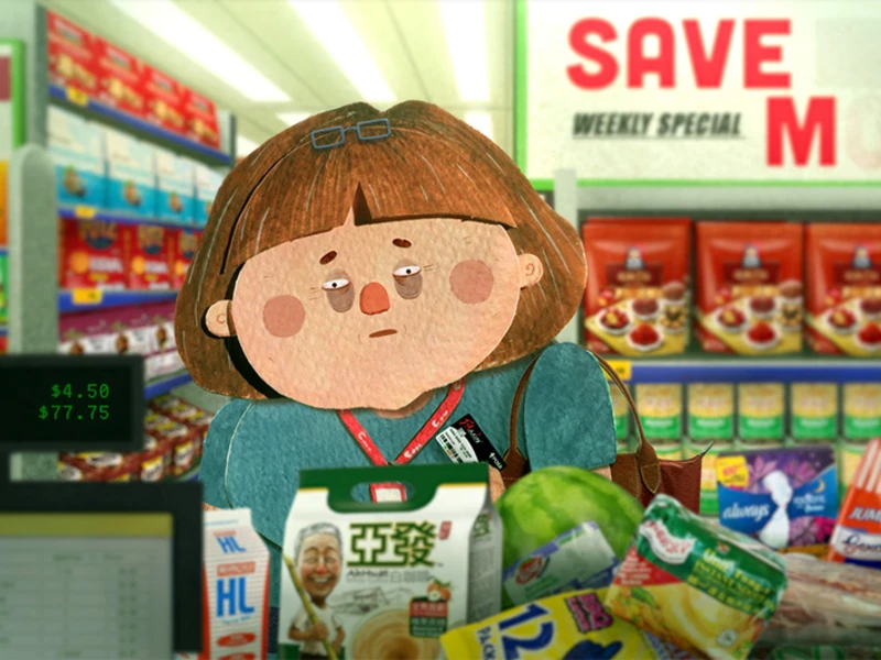 Supermarket checkout with character behind groceries and price display.