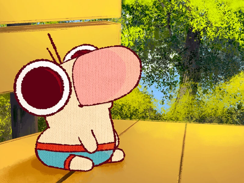 Cartoon character with a large pink nose and big eyes sitting on a wooden deck, with a green tree and blue sky in the background.