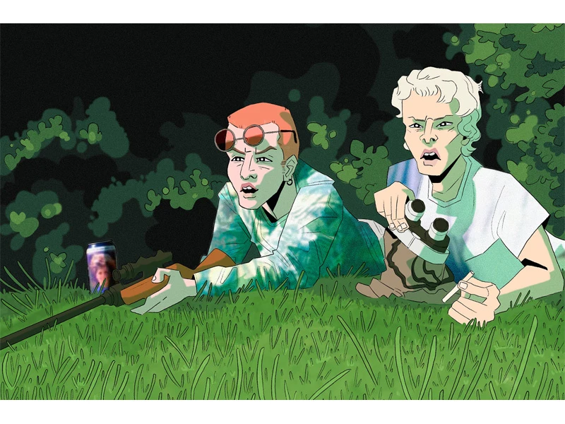 Two people lying on grass with a rifle, candle, and binoculars in a foliage-surrounded setting.