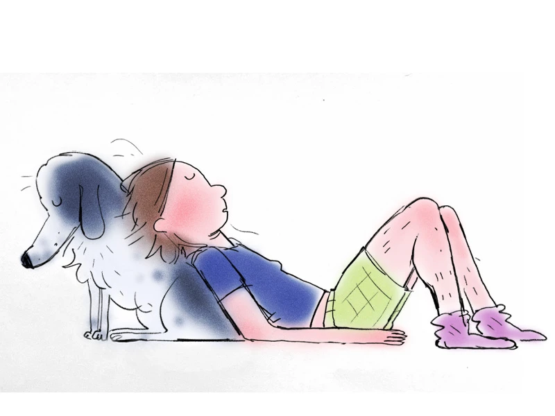 A person reclining against a large white and gray dog.