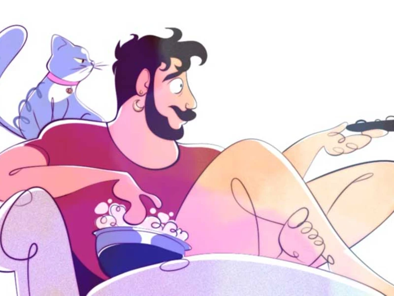 A man sitting on a chair with a remote control in one hand and a bowl of popcorn in the other, with a cat sitting on the chair's back.