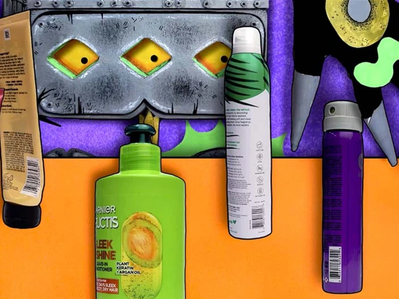 Assorted hair care products on a colorful background with a metallic object.