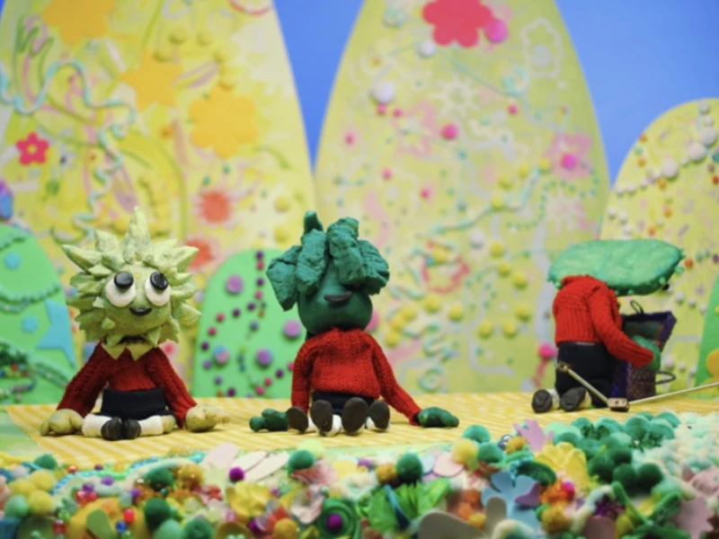 Whimsical clay figures with plant heads against a colorful, abstract background with cone-shaped hills.