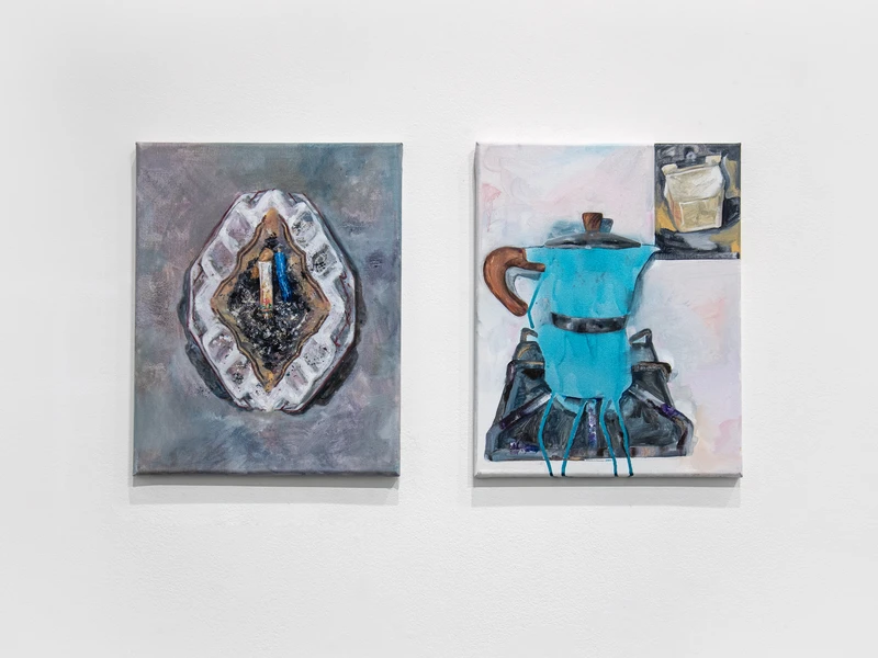Two paintings on a wall; one shows an ashtray with a cigarette, and the other depicts a turquoise moka pot on a stove.