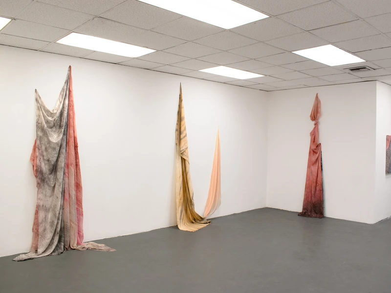 Various symbols and possibly some indistinct text on the cardboard are visible but not clear enough to transcribe accurately.