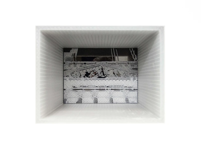 Engraving of the New York Stock Exchange inside a white, ribbed rectangular frame.