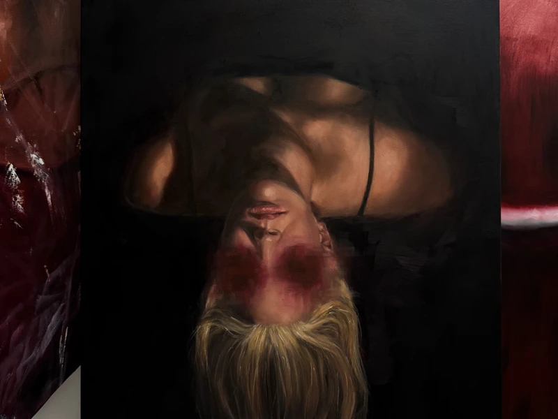 Painting of an upside-down person with blonde hair, dark background, and red areas around the eyes.