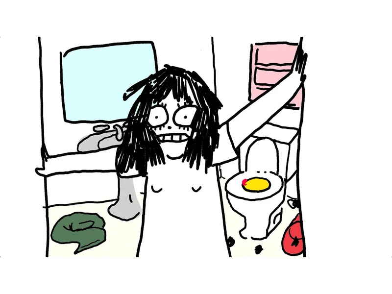 Girl with concerned look on her face standing in the doorway of a bathroom.