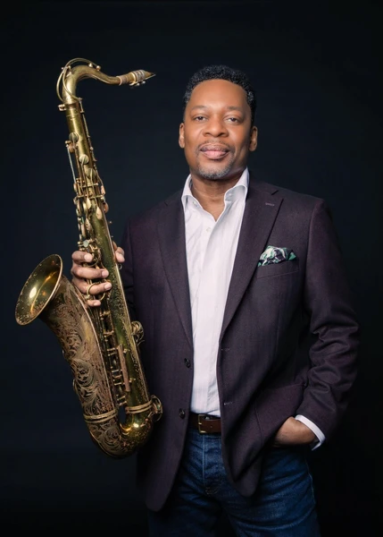 Ravi Coltrane holding a saxophone